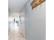 Hallway of condo with tile floor, coat rack on the wall and view to dining area at 707 S Ocean Blvd. # 602, North Myrtle Beach, SC 29582