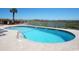 Community pool featuring an ocean view, surrounded by lounge chairs at 707 S Ocean Blvd. # 602, North Myrtle Beach, SC 29582