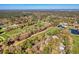 Expansive aerial view of a lush golf course, luxury homes and tranquil lakes at 95 Weehawka Way # 2, Pawleys Island, SC 29585