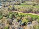 Aerial view of the community featuring beautiful landscaping and golf course at 95 Weehawka Way # 2, Pawleys Island, SC 29585