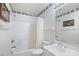 Clean, well-lit bathroom with shower-tub combo, toilet, and vanity with chrome faucet at 95 Weehawka Way # 2, Pawleys Island, SC 29585