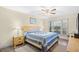 Cozy bedroom showcasing a wooden bed frame, wooden bedside tables and ceiling fan at 95 Weehawka Way # 2, Pawleys Island, SC 29585