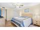 Bedroom boasts light walls, wood-look flooring, ceiling fan and closet doors at 95 Weehawka Way # 2, Pawleys Island, SC 29585