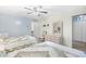 Bedroom featuring two twin beds, a ceiling fan, and a dresser with a mirror at 95 Weehawka Way # 2, Pawleys Island, SC 29585