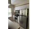 Kitchen with stainless steel appliances, ample cabinet space, and a bright window at 95 Weehawka Way # 2, Pawleys Island, SC 29585