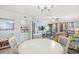 Bright open-concept living and dining area with sliding glass doors to the outside at 95 Weehawka Way # 2, Pawleys Island, SC 29585