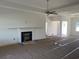 Bright living room featuring a ceiling fan and fireplace at 997 Oak Hollow St., Longs, SC 29568