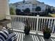 Relax on this spacious balcony with water views and lush landscaping for a serene outdoor experience at 1025 Ray Costin Way # 1008, Murrells Inlet, SC 29576