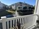 Enjoy the tranquil water views from this balcony overlooking a lush pond and manicured lawns at 1025 Ray Costin Way # 1008, Murrells Inlet, SC 29576