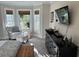 Bright bedroom featuring a bay window with seating, a dresser, and a mounted TV at 1025 Ray Costin Way # 1008, Murrells Inlet, SC 29576