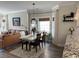 Bright dining area featuring a dining table and a view of the living room and kitchen at 1025 Ray Costin Way # 1008, Murrells Inlet, SC 29576