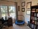 Bright office space featuring a desk, bookshelves, and a mini-trampoline for exercise at 1025 Ray Costin Way # 1008, Murrells Inlet, SC 29576