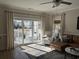 Bright living room featuring a sliding glass door to the patio, ceiling fan and comfortable seating at 1025 Ray Costin Way # 1008, Murrells Inlet, SC 29576