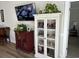 Cozy living room showcases a TV, white cabinet, and lush green plants at 1025 Ray Costin Way # 1008, Murrells Inlet, SC 29576