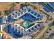 Bird's eye view of the condos showcasing a beautiful pool and parking available for the residents at 1101 Possum Trot Rd. # C-303, North Myrtle Beach, SC 29582