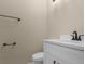 Half bathroom featuring a white vanity, black fixtures, and contemporary design at 1101 Possum Trot Rd. # C-303, North Myrtle Beach, SC 29582