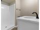 Bathroom featuring a white vanity with black fixtures and a white shower stall at 1101 Possum Trot Rd. # C-303, North Myrtle Beach, SC 29582