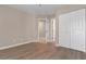Neutral bedroom with wood flooring and a closet at 1101 Possum Trot Rd. # C-303, North Myrtle Beach, SC 29582