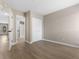 Neutral bedroom with wood flooring, a closet, and an adjoining bathroom at 1101 Possum Trot Rd. # C-303, North Myrtle Beach, SC 29582