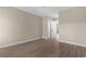 This bedroom features neutral walls, wood-look floors, and a closet for ample storage at 1101 Possum Trot Rd. # C-303, North Myrtle Beach, SC 29582