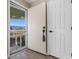 Condo entryway with an open door and wood-look flooring at 1101 Possum Trot Rd. # C-303, North Myrtle Beach, SC 29582
