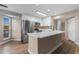 Updated kitchen with white cabinets, stainless steel appliances, and quartz countertops at 1101 Possum Trot Rd. # C-303, North Myrtle Beach, SC 29582