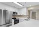 Kitchen featuring white cabinets and stainless steel appliances at 1101 Possum Trot Rd. # C-303, North Myrtle Beach, SC 29582
