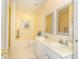 Well-lit bathroom with double vanity, large tub, and a separate shower at 110-4 White Tail Way # 4, Pawleys Island, SC 29585