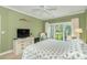 Bright bedroom with a comfortable bed, fan, and access to a balcony at 110-4 White Tail Way # 4, Pawleys Island, SC 29585