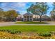Picturesque clubhouse view surrounded by well-manicured lawns and vibrant flower beds at 110-4 White Tail Way # 4, Pawleys Island, SC 29585