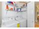 Functional laundry room with shelving, washer, and dryer for convenient chores at 110-4 White Tail Way # 4, Pawleys Island, SC 29585