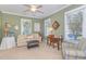 Inviting living room with a sofa, desk, armchair, and bright windows at 110-4 White Tail Way # 4, Pawleys Island, SC 29585