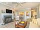 Warm living room with fireplace, built-in bar area, and view into the kitchen at 110-4 White Tail Way # 4, Pawleys Island, SC 29585