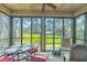 Relaxing screened porch with outdoor seating, ceiling fan and serene views at 110-4 White Tail Way # 4, Pawleys Island, SC 29585