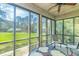 This spacious screened porch offers beautiful views of the surrounding landscape at 110-4 White Tail Way # 4, Pawleys Island, SC 29585