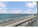 Scenic view of the ocean and sandy beach from the condo balcony, under a blue sky at 1105 S Ocean Blvd. # 1224, Myrtle Beach, SC 29577