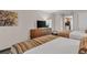 Relaxing bedroom featuring a TV and access to a kitchen at Coral Beach Resort at 1105 S Ocean Blvd. # 1224, Myrtle Beach, SC 29577