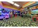 Brightly lit arcade and game room with various gaming machines at 1105 S Ocean Blvd. # 1224, Myrtle Beach, SC 29577