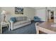 A cozy living room featuring a three-seater sofa and striped chair at 1105 S Ocean Blvd. # 1224, Myrtle Beach, SC 29577