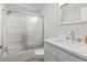 Neutral bathroom with a shower-tub, white sink and cabinet, mirror, and white toilet at 1136 Knotty Branch Rd., Conway, SC 29527