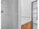A bathroom showing a standard sink, wooden vanity, and shower stall next to a small window and bedroom at 1136 Knotty Branch Rd., Conway, SC 29527