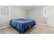 Bright bedroom with hardwood floors and two windows, offering ample natural light at 1136 Knotty Branch Rd., Conway, SC 29527