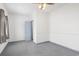 Bedroom featuring gray carpeting and a fan; neutral paint with a doorway to another space at 1136 Knotty Branch Rd., Conway, SC 29527