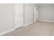 Neutral bedroom with a new floor, two white doors, light grey walls, and white trim at 1136 Knotty Branch Rd., Conway, SC 29527