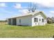 Exterior of the garage shows ample parking with an attached carport and grassy yard at 1136 Knotty Branch Rd., Conway, SC 29527