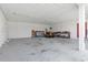 Spacious garage interior with concrete floors offers substantial parking, and lawn care equipment at 1136 Knotty Branch Rd., Conway, SC 29527