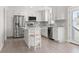 Bright and modern kitchen with white cabinets, stainless steel appliances, and stylish backsplash at 1136 Knotty Branch Rd., Conway, SC 29527