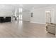 Expansive living room with light flooring, opening to the kitchen and bathroom areas at 1136 Knotty Branch Rd., Conway, SC 29527