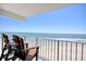 Enjoy ocean views from this balcony that features 2 chairs and an unobstructed view of the beach at 1210 N Waccamaw Dr. # 408, Garden City Beach, SC 29576