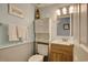 Charming bathroom with a vanity, decorative accents, and ample storage at 1210 N Waccamaw Dr. # 408, Garden City Beach, SC 29576